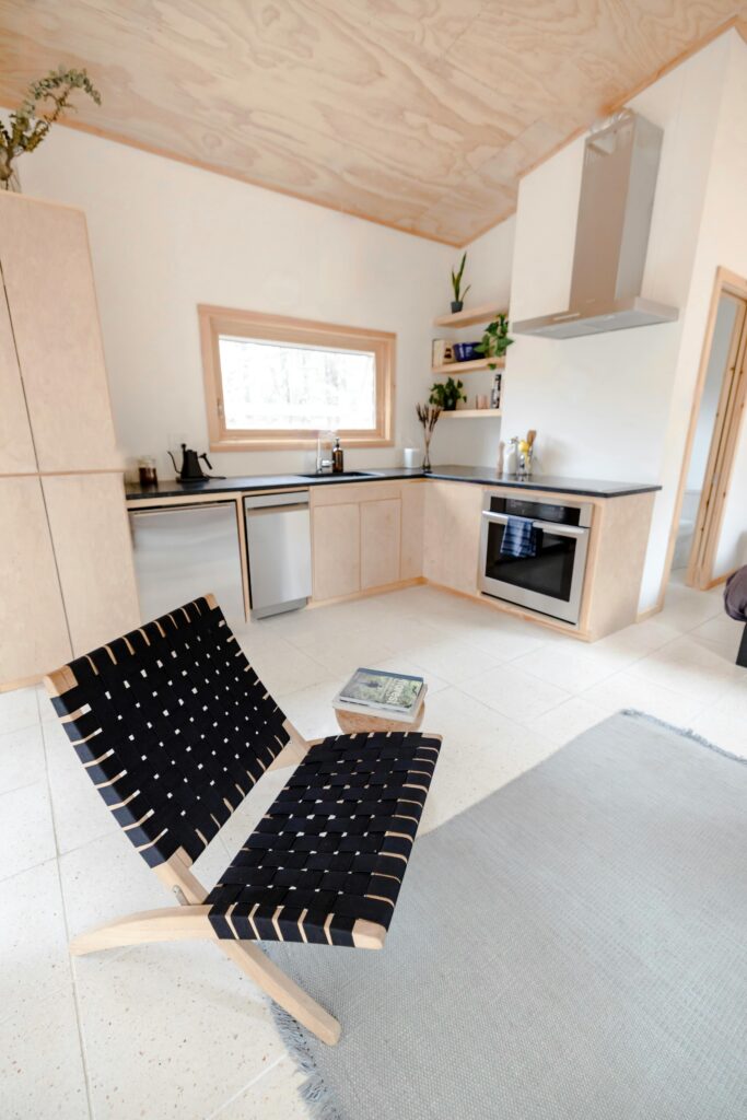 pexels photo 12003594 12003594 Contemporary kitchen interior with sleek furniture and modern decor.